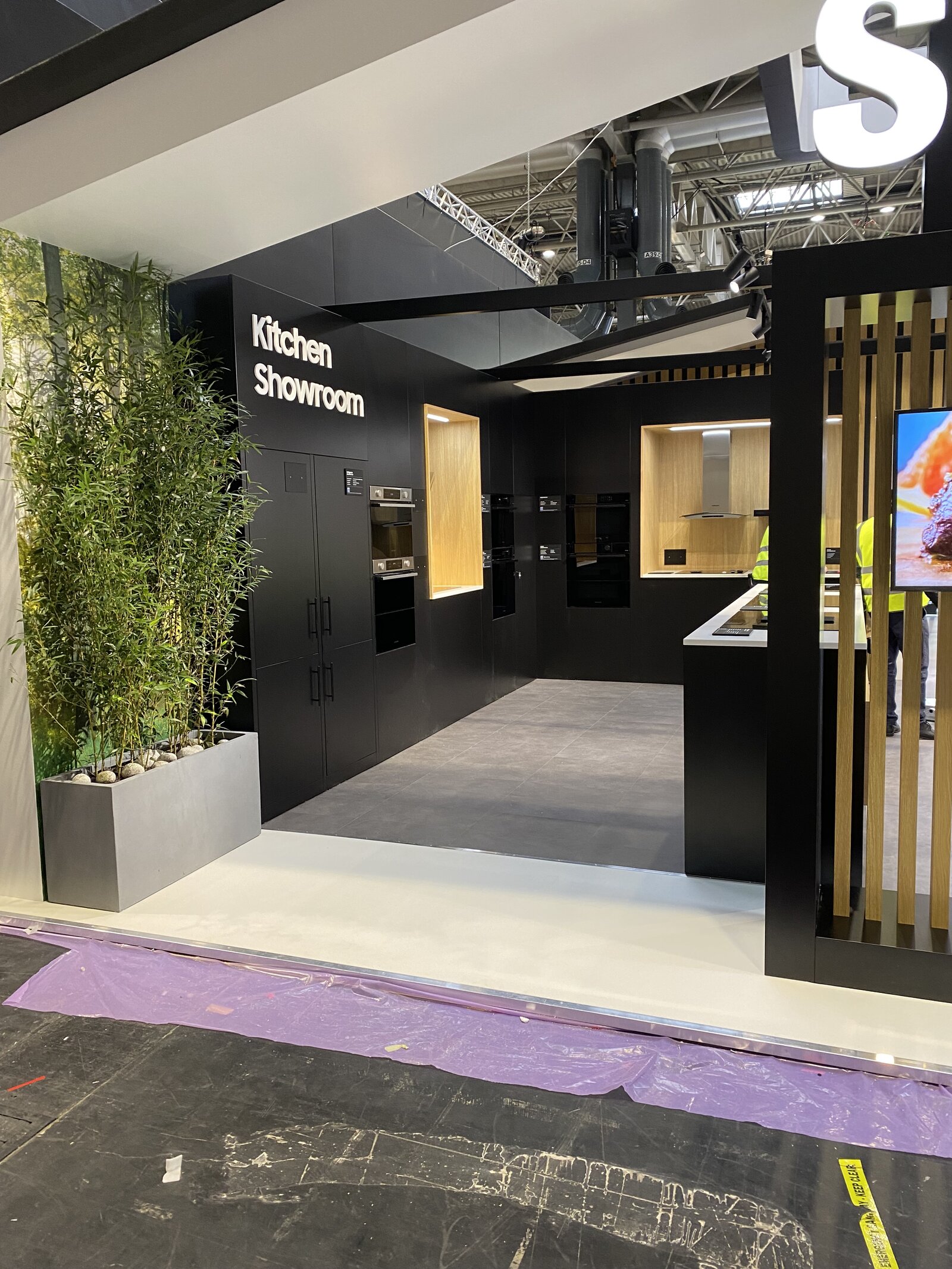 Samsung KBB stand in production — entrance and Kitchen Showroom signage